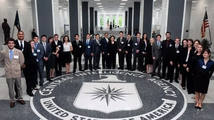 Intelligence Agencies: CIA analysts in a high-tech operations center, monitoring global events on multiple screens, showcasing the agency's cutting-edge technological capabilities.