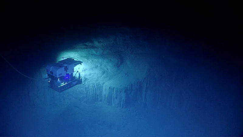 Submersible vehicle exploring the vast ocean's abyss.