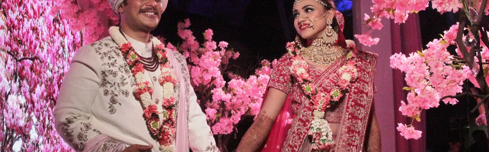 weddings in India: Indian couple exchanging garlands in a simple, eco-friendly wedding ceremony.